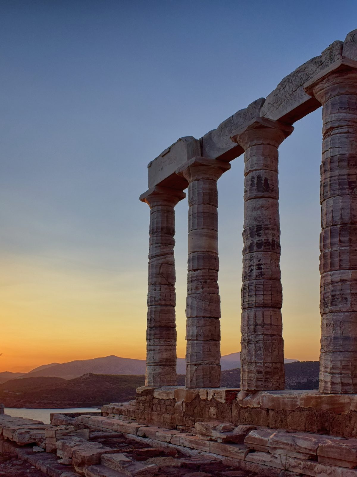 The Temple of Poseidon at Cape Sounion at sunset, on the Athens Riviera