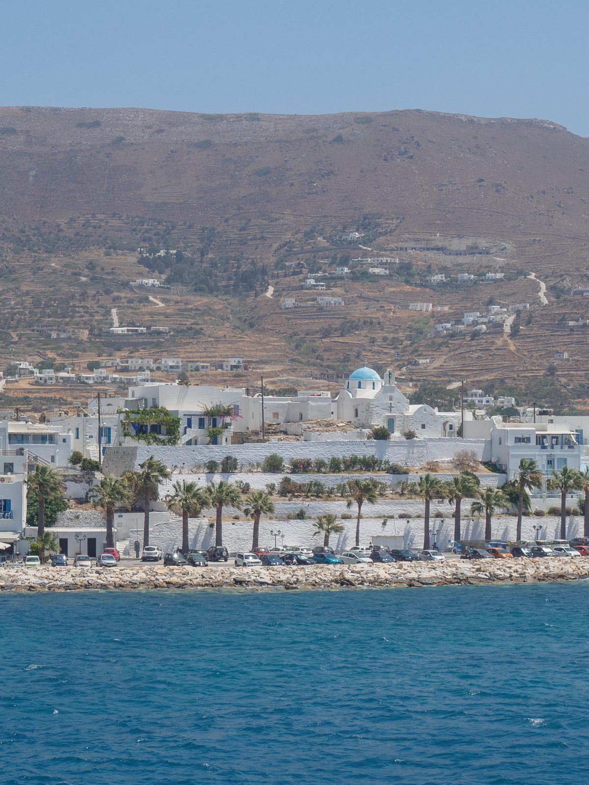 The white town of Parikia on Paros above turquoise water